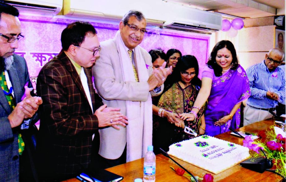 Managing Director of Dhaka WASA Engr Taqsem A Khan, among others, at a cake cutting ceremony organized on the occasion of International Women's Day in the conference room of Dhaka WASA Bhaban in the city on Sunday.