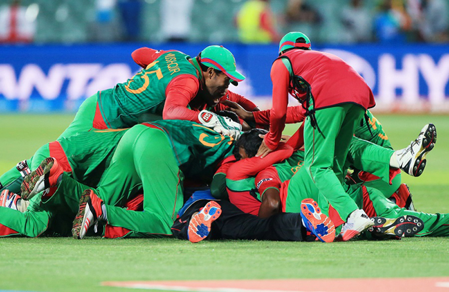 Bangladesh players celebrate after they defeated England by 15 runs in their Cricket World Cup Pool A match in Adelaide, Australia on Monday.