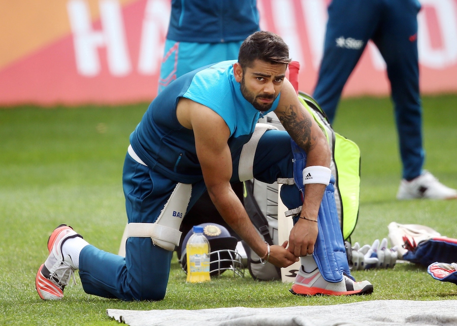 India's Virat Kohli puts on his protective pads during a training session ahead of their 2015 Cricket World Cup Group B match against Ireland in Hamilton on Monday.