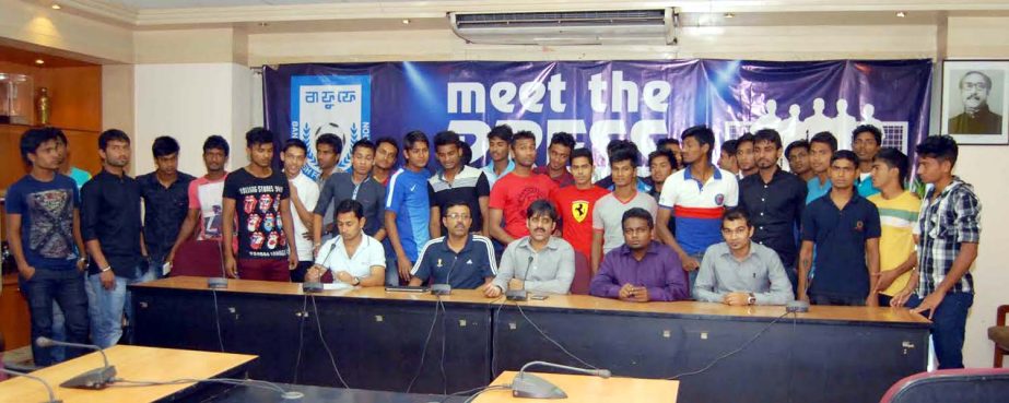36 footballers and Manager Amirul Islam Babu pose for a photograph after reporting to Babu at the conference room of Bangladesh Football Federation House on Tuesday.