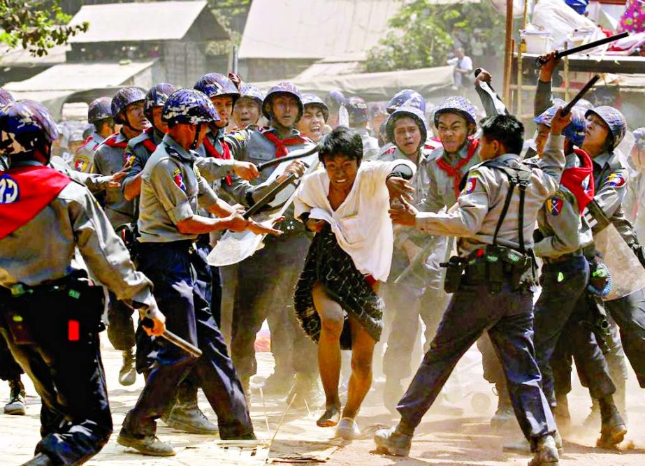 Police hit a student protester during violence in Letpadan on Tuesday.