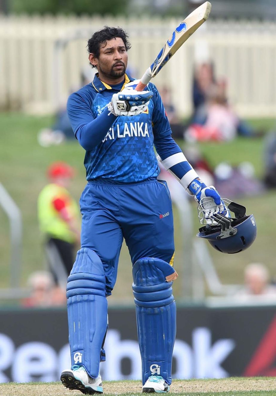 Sri Lanka batsman Tillakaratne Dilshan raises his bat after scoring a century during the 2015 Cricket World Cup Pool A match between Scotland and Sri Lanka in Hobart on Wednesday.