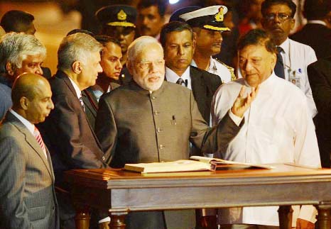 Indian Prime Minister Narendra Modi gestures after his arrival at Bandaranaike International Airport in Katunayake, Sri Lanka on Friday..