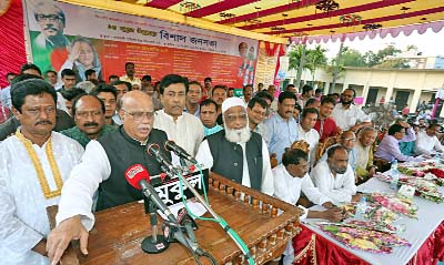 BOGRA: Health and Family Welfare Minister Mohammad Nasim speaking at a mass meeting organised by 14- party alliance at Gabtoli Pilot High School premises on Monday.