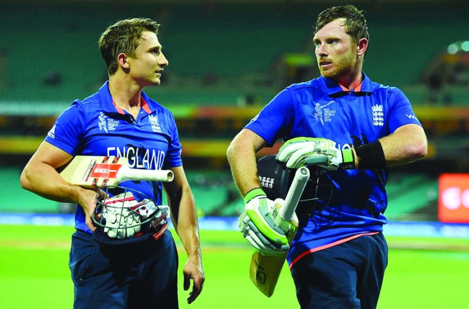James Taylor and Ian Bell walk off after sealing a nine-wicket win in the 2015 Cricket World Cup match between England and Afghanistan at Sydney Cricket Ground in Sydney, Australia on Friday.