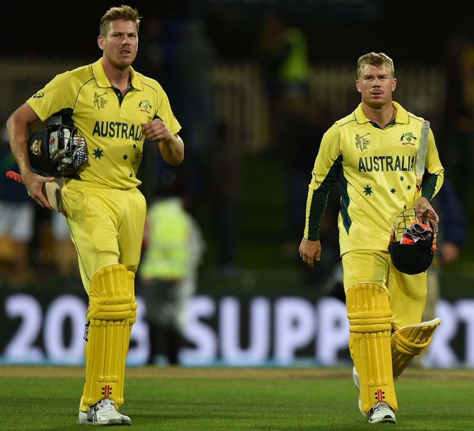 Australian cricketers James Faulkner (L) and David Warner walk off after scoring the winning runs at the Bellerive Oval during the 2015 Cricket World Cup Pool A match between Australia and Scotland in Hobart on Saturday.