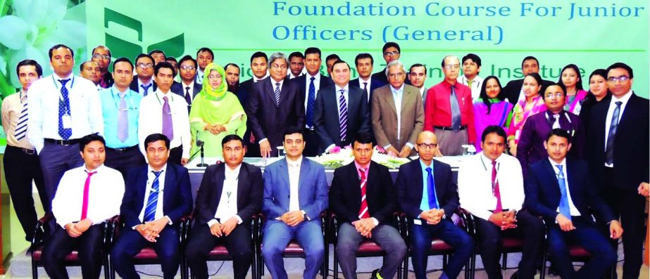 Shamsul Huda Khan, Managing Director and CEO of National Bank Limited, poses with participants of a 'Foundation Training Course' at its training institute recently.