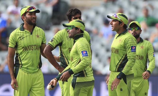 Pakistanâ€™s Umar Akmal (center) celebrates with teammates after taking a catch to dismiss Irelandâ€™s Stuart Thompson during their Cricket World Cup Pool B match in Adelaide, Australia on Sunday.