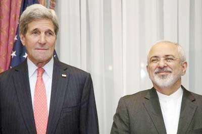 US Secretary of State John Kerry (L) and Iran's Foreign Minister Mohammad Javad Zarif pose for a photograph before resuming talks over Iran's nuclear programme in Lausanne on Monday.
