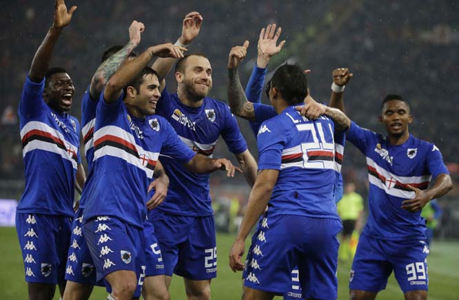 Sampdoria's Luis Muriel (second right) celebrates with his teammates after scoring during a Serie A soccer match between Roma and Sampdoria, at Rome's Olympic Stadium on Monday.