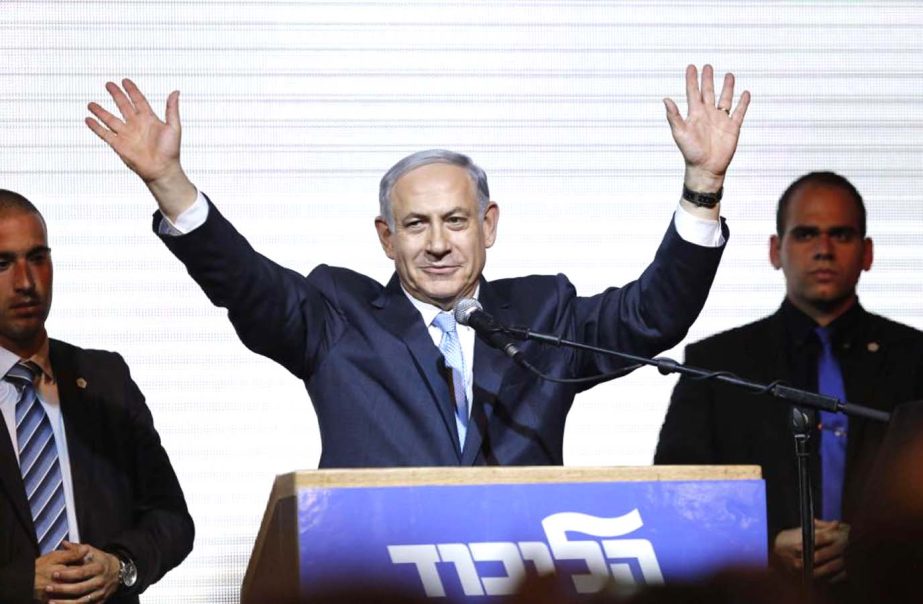 Israeli Prime Minister Benjamin Netanyahu waves to supporters at the party headquarters in Tel Aviv on Wednesday.