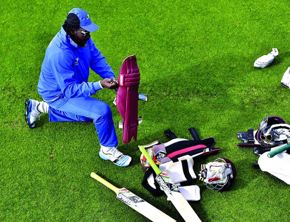 Chris Gayle of the West Indies pads up during a training session ahead of their 2015 Cricket World Cup quarter-final match against New Zealand at the Basin Reserve in Wellington on Friday.