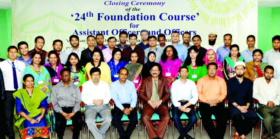 M Kamran Hamid, Principal of BASIC Bank Training Institute poses with the trainees of 24th foundation course at its institute in the city recently.