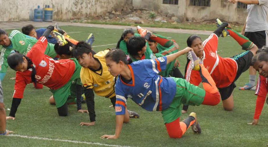 Members of Bangladesh National Girls' Under-14 team taking part at the practice session at the BFF Artificial Turf on Saturday.