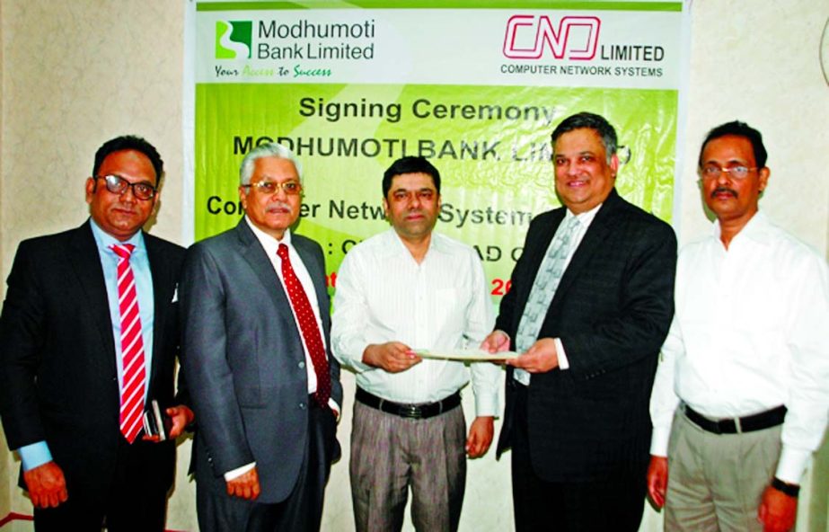 Md Shafiul Azam, Additional Managing Director of Modhumoti Bank Limited and Md Ikram Iqbal, Director of Computer Network System sign a deal on Monday that customers of the bank to pay motor vehicle registration fee, tax token renewal fee, fitness fee and