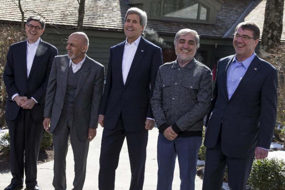 Secretary of State John Kerry, centre, shares a laugh with from left, Treasury Secretary Jacob Lew, Afghanistan's President Ashraf Ghani, Kerry, Afghanistan's Chief Executive Abdullah Abdullah, and Defence Secretary Ash Carter after speaking before the