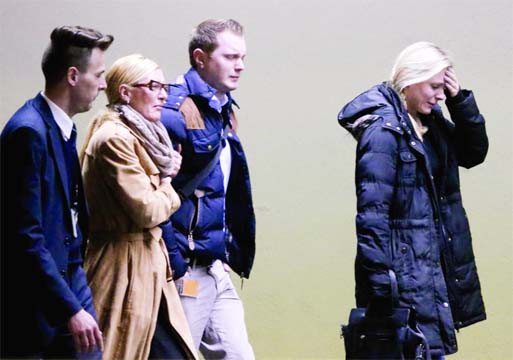 Crying people arrive at the airport in Duesseldorf, Germany after a Germanwings passenger jet carrying all 150 people crashed in the French Alps region as it traveled from Barcelona to Duesseldorf on Tuesday.