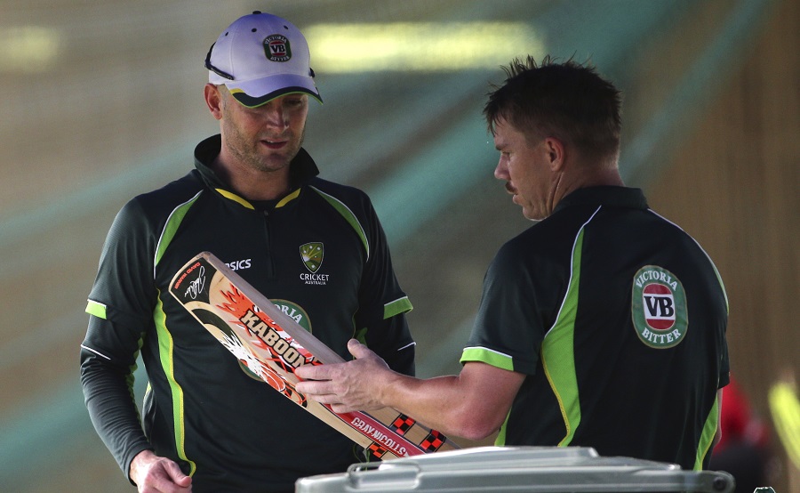 Australia's captain Michael Clarke (left) chats with David Warner after batting practice for the Cricket World Cup in Sydney, Australia on Wednesday. Australia will play India in a World Cup semifinal today (Thursday) to gain a place in the final against