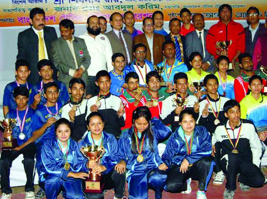 The winners of the Southeast Bank Limited National Table Tennis Championship with the officials and guests of Bangladesh Table Tennis Federation and Gopalganj District Sports Association pose for a photograph at the Gymnasium of Gopalganj District Sports