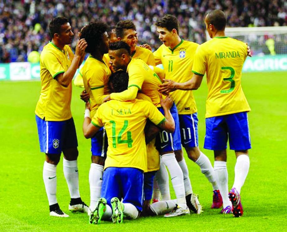 The Brazilian team celebrate the winning goal of Luis Gustavo during the friendly soccer match between France and Brazil at the Stade de France, north of Paris, France on Thursday. Brazil won against France 3-1.