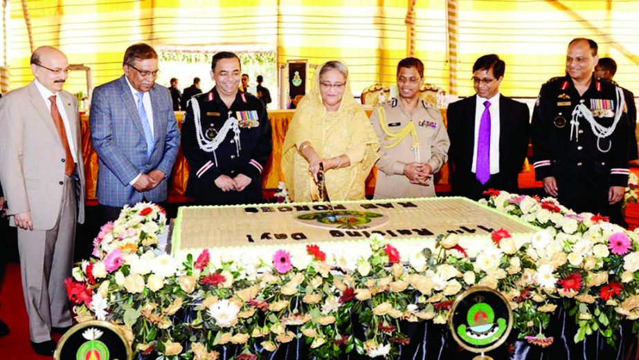 Prime Minister Sheikh Hasina cutting cake marking 11th founding anniversary of RAB at its Headquarters in the city's Kurmitola on Saturday. BSS photo