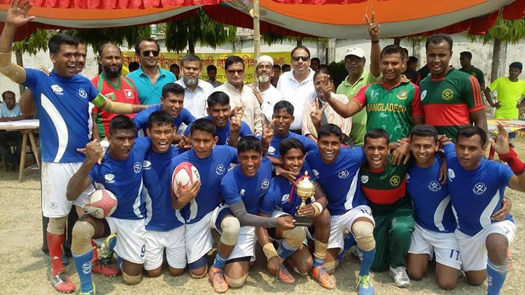 Bangladesh Army, the champions of the Quick City Independence Day Rugby Competition with the guests and officials of Bangladesh Rugby Federation pose for a photo session at the Physical Education College Ground in Mohammadpur on Saturday.