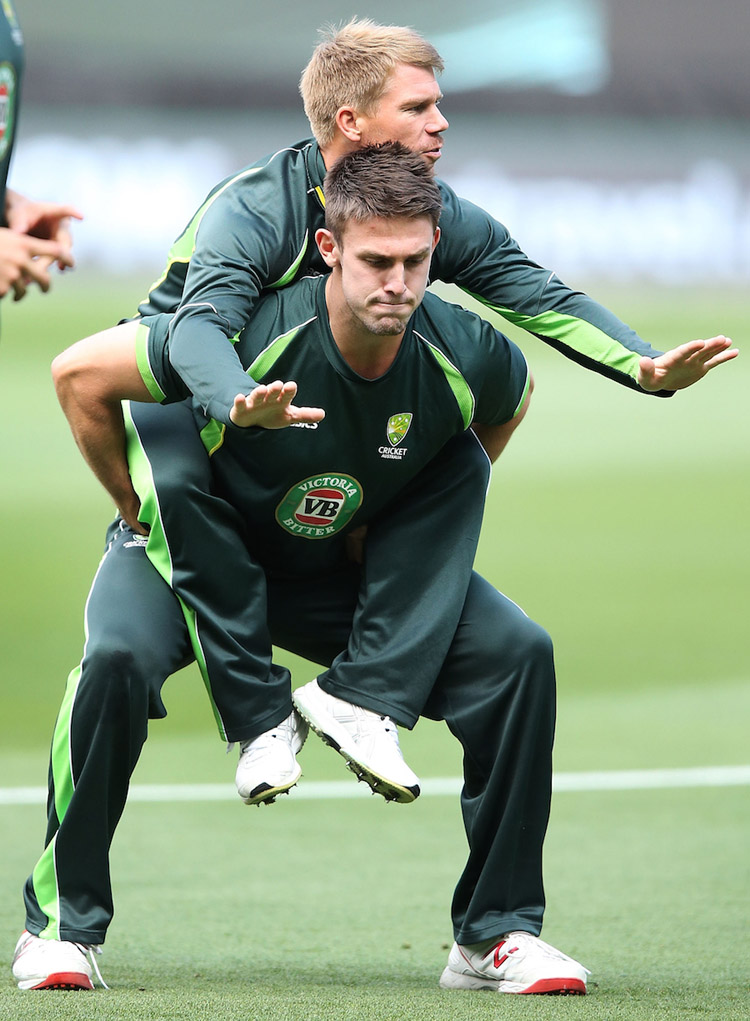 David Warner gets a piggy back from Mitch Marsh during an Australian nets session at Melbourne Cricket Ground in Melbourne, Australia on Saturday.