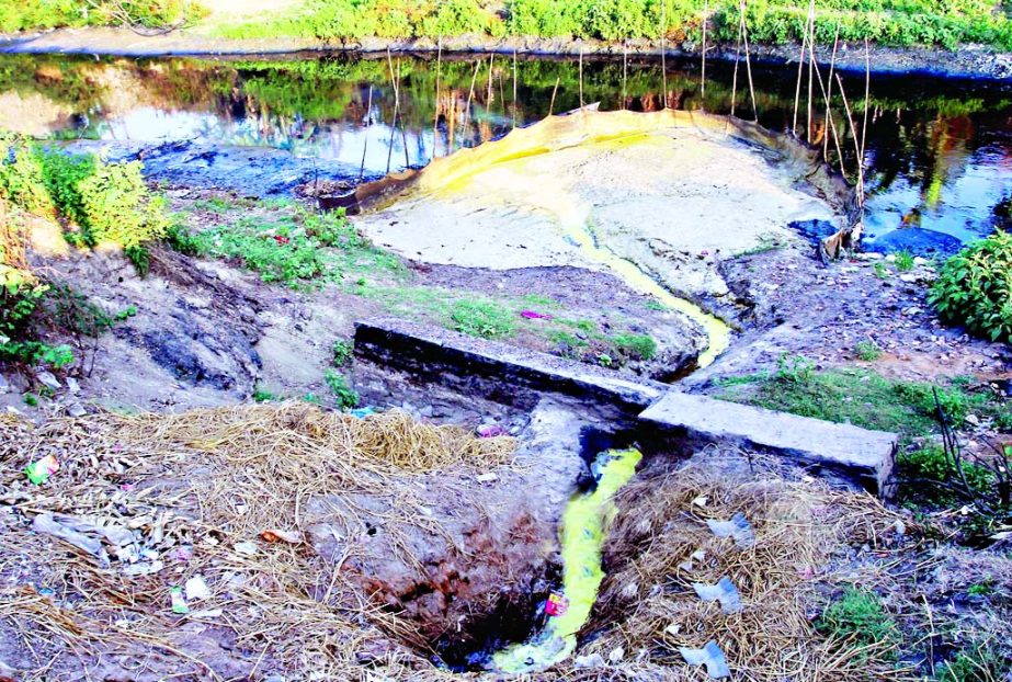 Effluents from local factories are finding their way into the river Sitalakkhya through illegal canal that polluting river water and hazards of environment. This photo was taken from Tarabo areas of Roopganj in N'ganj on Saturday.