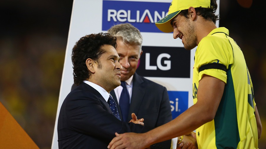 Mitchell Starc receives the Man-of-the-Series award from Sachin Tendulkar at Melbourne Cricket Ground in Melbourne, Australia on Sunday.