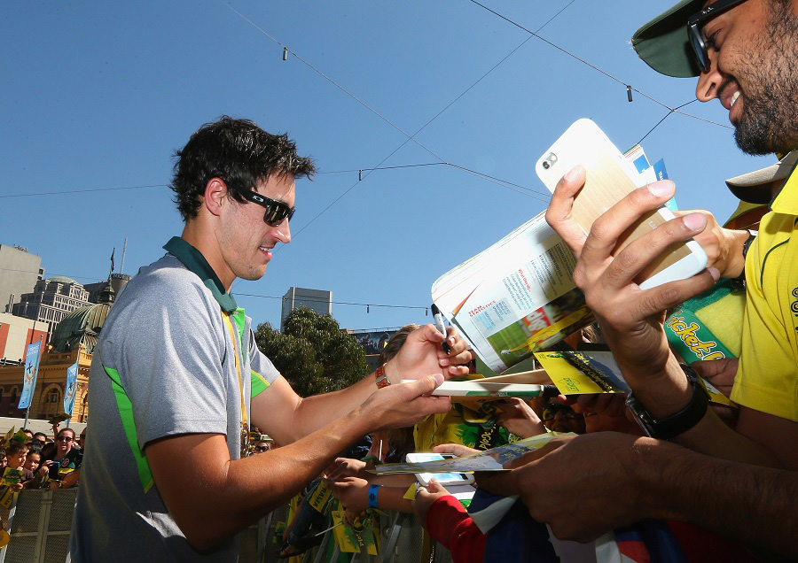 Mitchell Starc signs autographs during celebrations after winning the 2015 ICC Cricket World Cup Final at Federation Square in Melbourne, Australia on Monday .