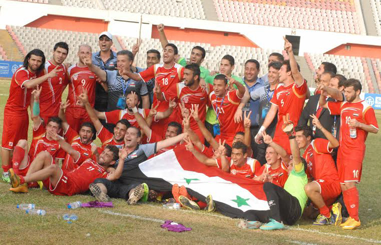 Syria Under-23 Football team, the champions of the AFC Under-23 Championship Qualifiers pose for a photo session after beating Uzbekistan Under-23 Football team in their last match at the Bangabandhu National Stadium on Tuesday.