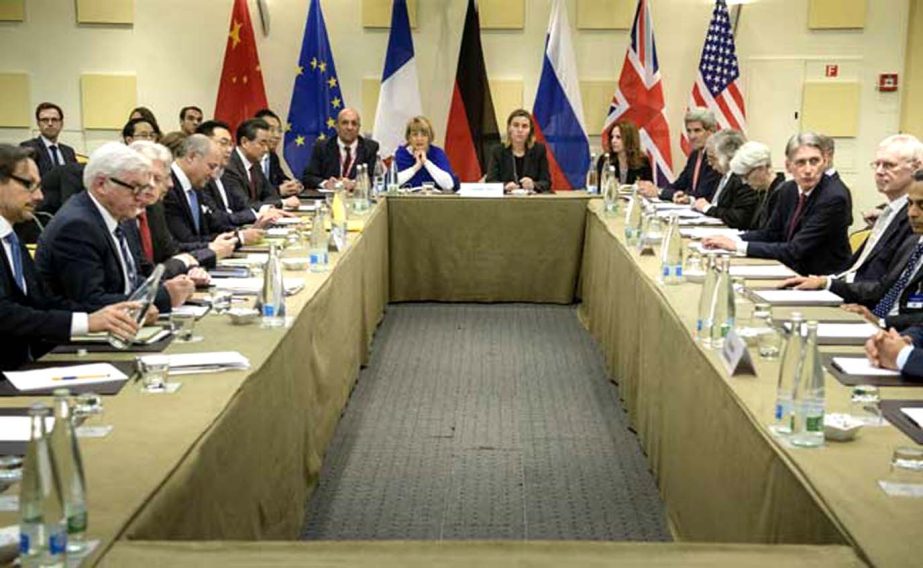 Representatives of European and world powers pose prior to meeting to pin down a nuclear deal with Iran, on Tuesday.