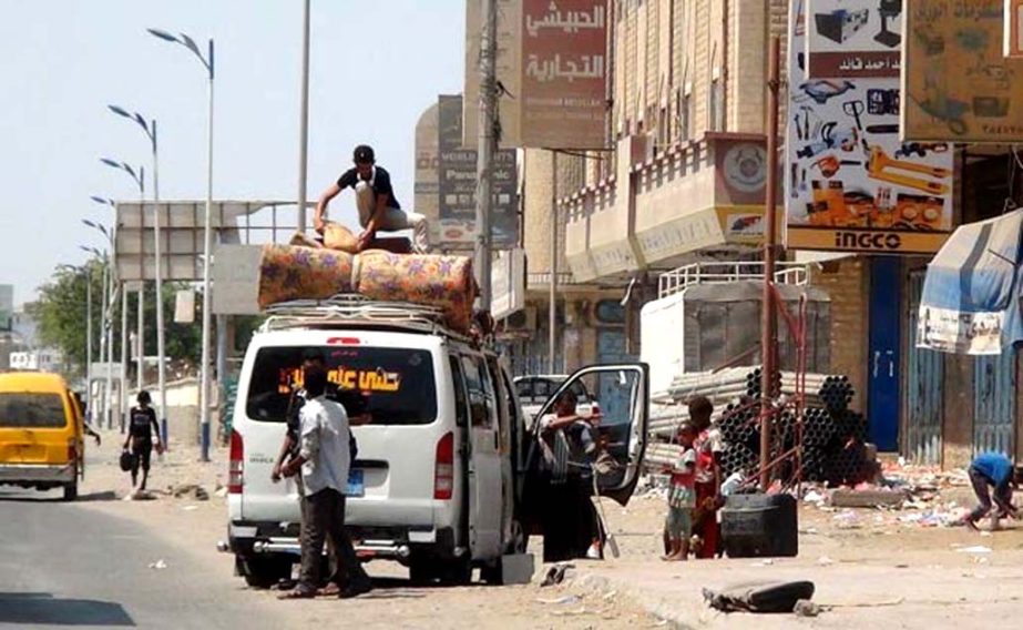 While Arab coalition warplanes continue to carry out air strikes against Shiite Huthi rebels, Yemeni's pack their belongings onto a vehicle as they flee from the southern Yemeni city of Aden.