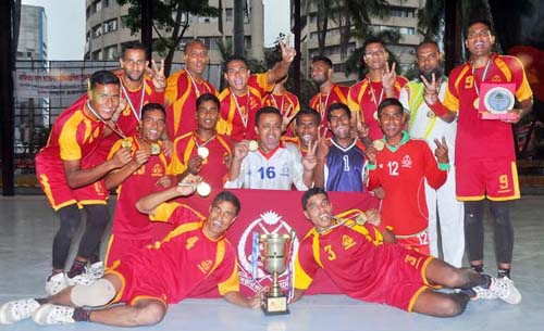 Members of BGB, the champions of the Independence Cup Handball Competition (Men's Division) pose with the trophy at the Shaheed (Capt) M Mansur Ali National Handball Stadium on Wednesday.