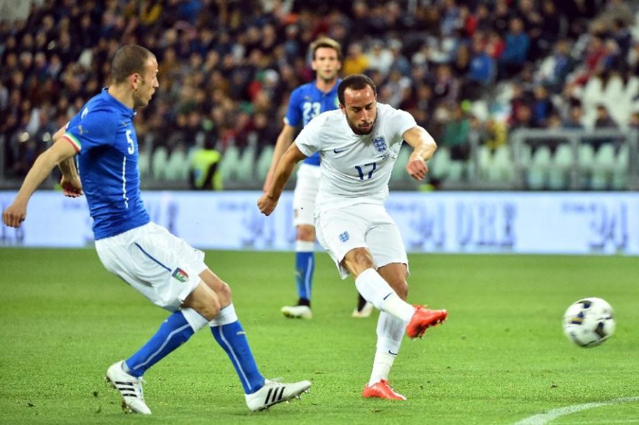 England's midfielder Andros Townsend (right) shoots to score a goal during the friendly football match Italy vs England at the Juventus Stadium in Turin on Tuesday.