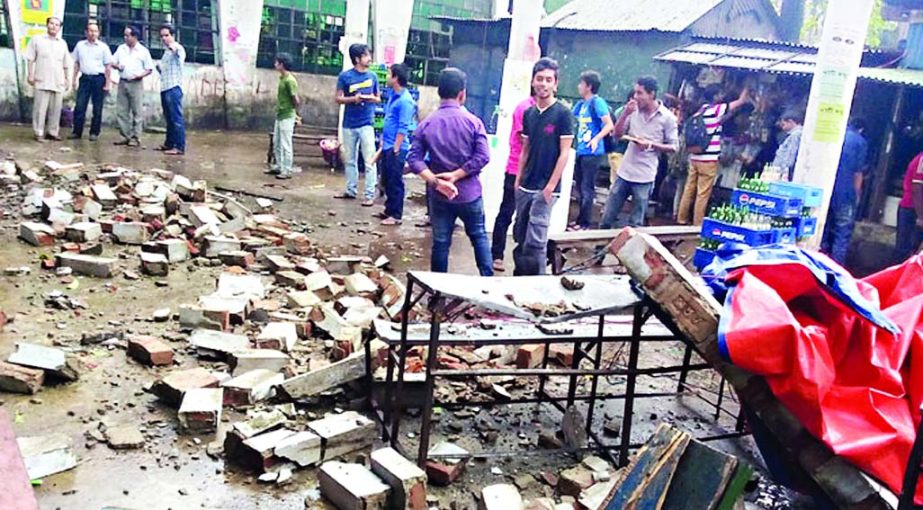 Two persons (not in picture) including a student were injured when a portion of wall of Surya Sen Hall of Dhaka University collapsed on Wednesday.