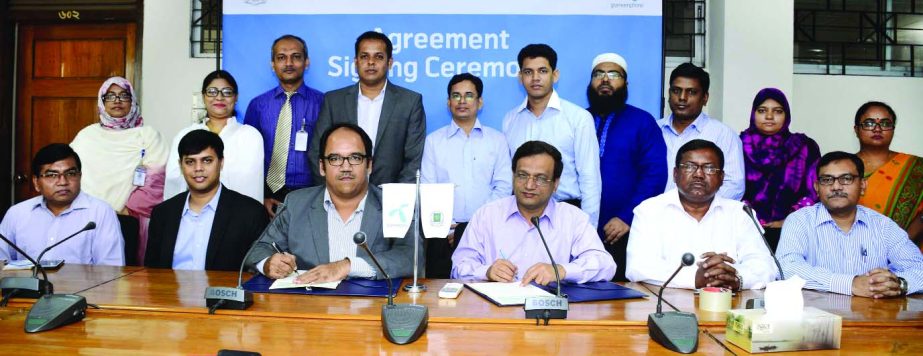 NM Zeaul Alam, Director General, Department of Immigration and Passports and Sajjad Alam, Head of Direct Sales, Grameenphone Ltd, sign a deal to provide complete communications solutions under its Business Solutions package recently.