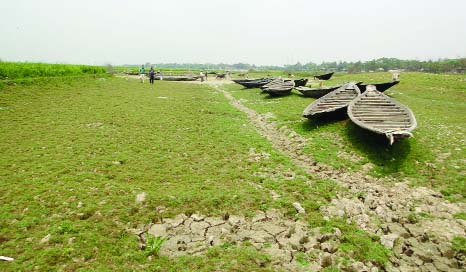 NASIRNAGAR(Brahmonbaria): Fishing boats remain idle as Urol canal and Singra River dried up at Nasirnagar Upazila. This picture was taken on Wednesday.