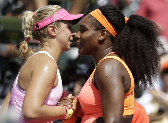 Sabine Lisicki of Germany (left) meets Serena Williams (right) at the net after their quarterfinal match at the Miami Open tennis tournament in Key Biscayne, Fla on Wednesday. Williams won the match 7-6 (4), 1-6, 6-3.