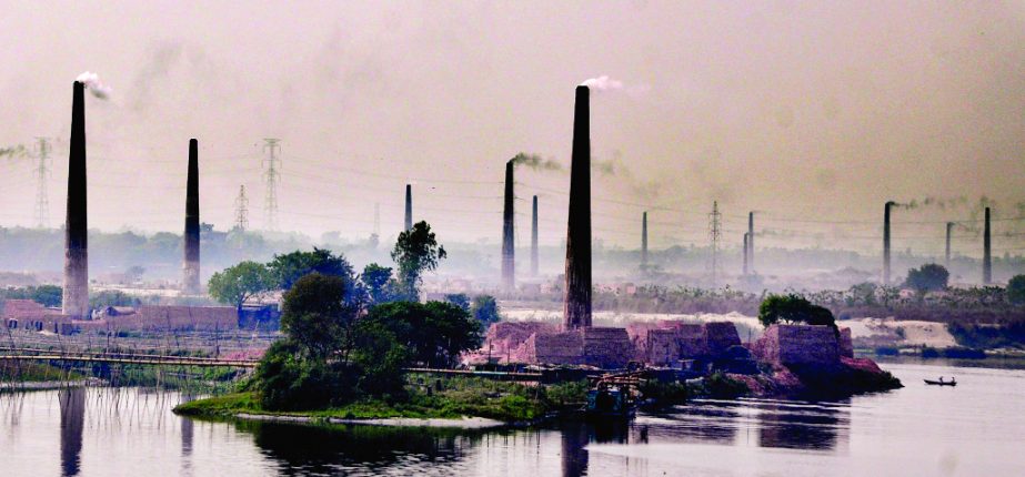 Smokes from scores of illegal brick kilns at Gabtoli area in the outskirts of the city is polluting the air unchecked. It is endangering public health, but the authorities concerned are keeping their eyes shut. This photo was taken on Thursday.