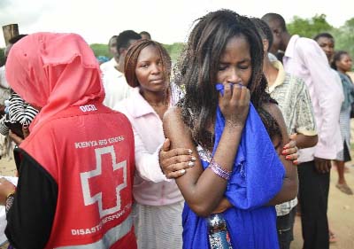 Students evacuated from Moi University during a terrorist siege gather together in Garissa on Friday.