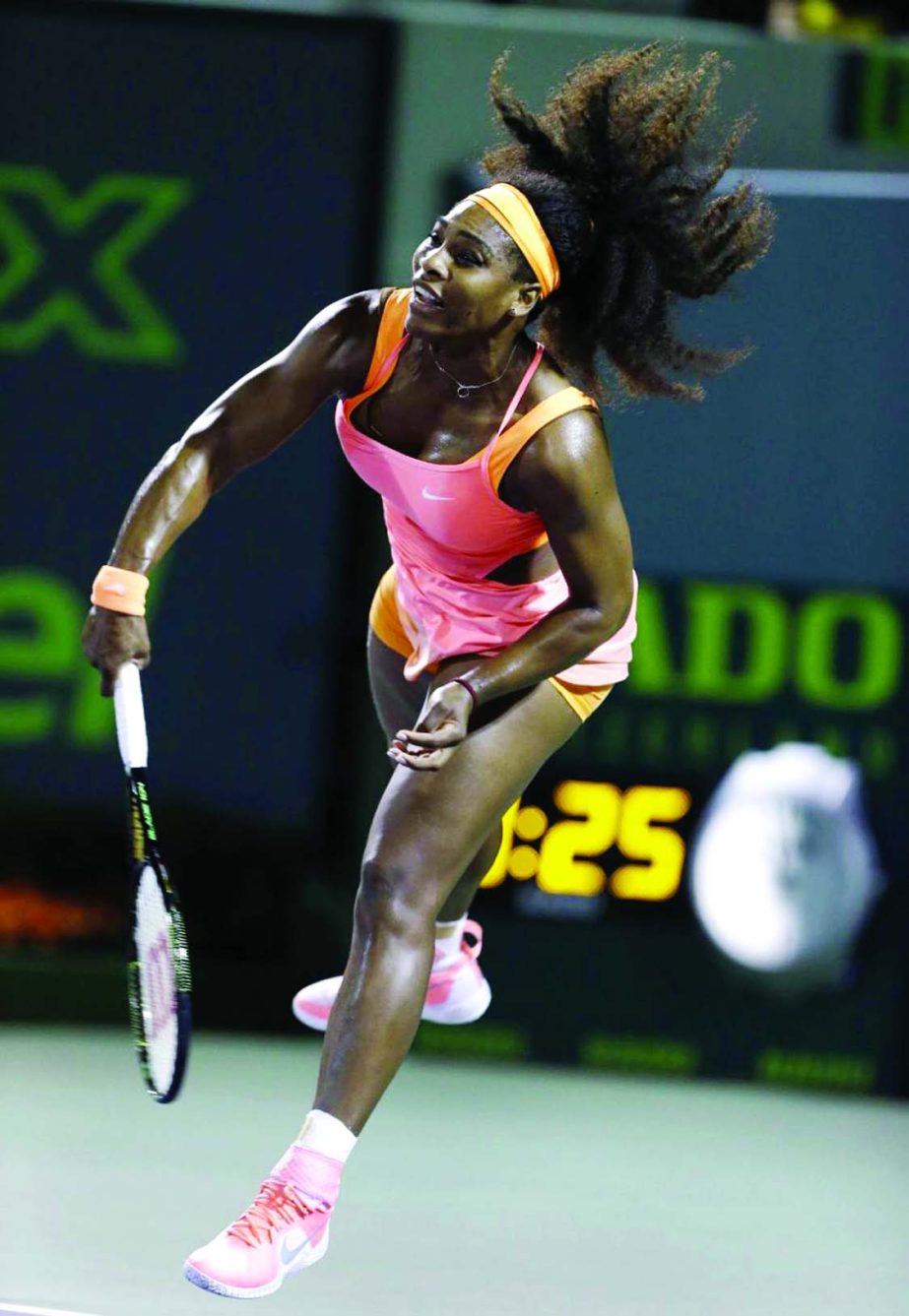 Serena Williams of the United States serves to Simona Halep of Romania at the Miami Open tennis tournament in Key Biscayne, Fla on Thursday.