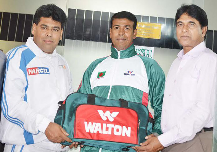 First Senior Additional Director of RB Group FM Iqbal Bin Anwar Dawn (left) handing over the jerseys to Coach of Throw Ball BM Shahiduzzaman (centre) at the conference room of Walton on Saturday. BM Shahiduzzaman will stay in Malaysia from April 13 to Apr