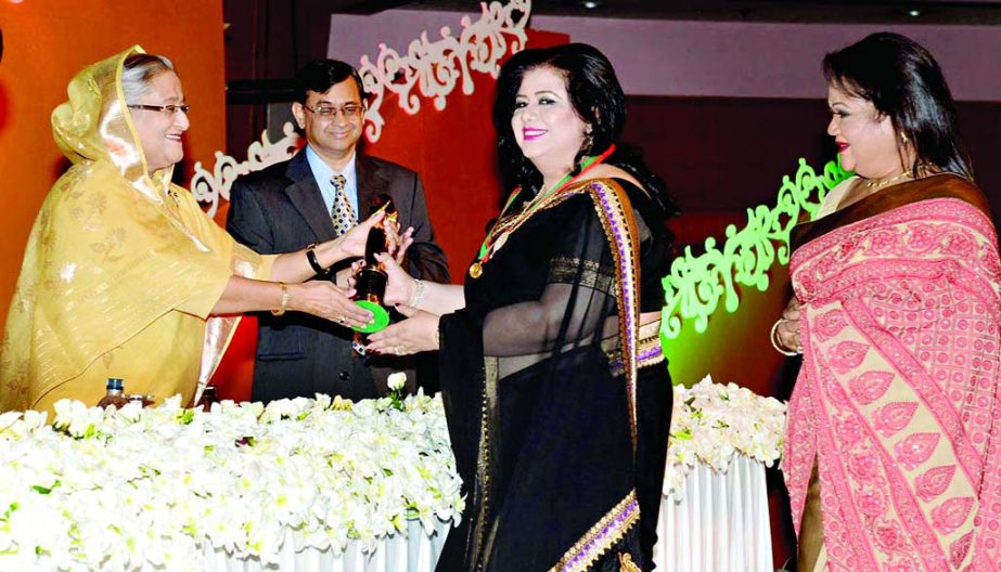 Runa Laila and Sabina Yasmin receiving best singer award from Prime Minister Sheikh Hasina on the occasion of National Film Award 2013 distribution ceremony at Bangabandhu International Conference Centre on Saturday.