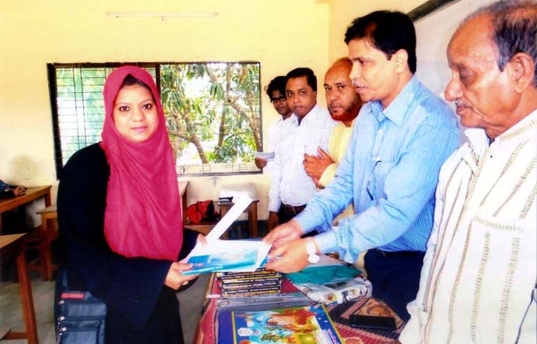 Eminent educationist Nurul Alam , Principal , CDA Girls' School and College distributing citation among the students at a function in the city yesterday.