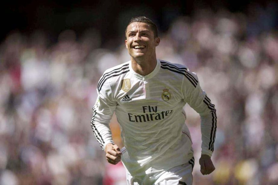 Real Madrid's Cristiano Ronaldo celebrates after scoring a goal during a La Liga soccer match between Real Madrid and Granada at the Santiago Bernabeu stadium in Madrid, Spain on Sunday.