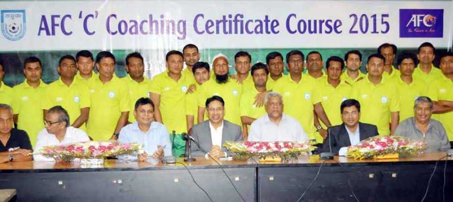 The participants of the AFC 'C' Coaching Certificate Course with the officials of BFF pose for a photo session at the BFF House on Sunday.