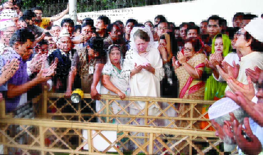 BNP Chairperson Begum Khaleda Zia along with her party colleagues offering munajat for her son late Arafat Rahman Koko when she visited Koko 's grave in the city's Banani on Monday.