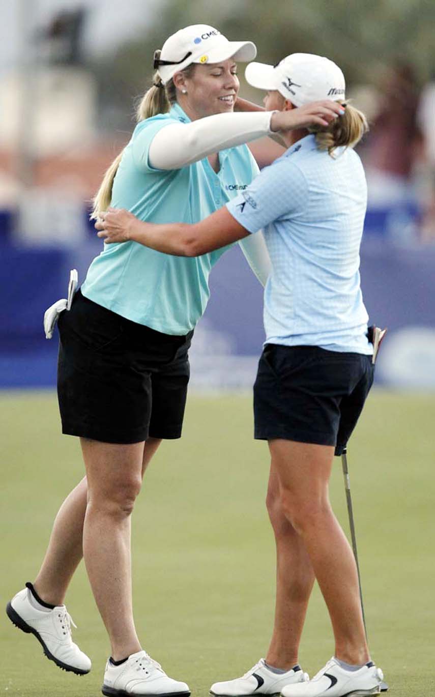 Brittany Lincicome (left) hugs Stacy Lewis after winning on the third playoff hole in the LPGA Tour ANA Inspiration golf tournament at Mission Hills Country Club in Rancho Mirage, Calif on Sunday.