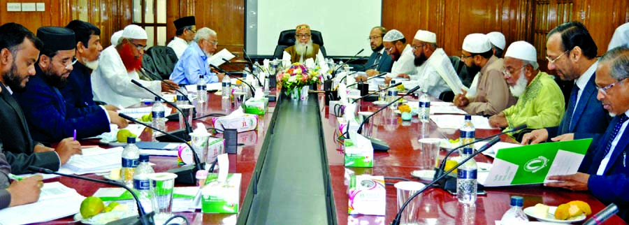 Sheikh Moulana Mohammad Qutubuddin, Chairman of the Shari'ah Council of Islami Bank Bangladesh Ltd and President of Baitush Sharaf Anjuman-e-Ittehad Bangladesh, presiding over the council's meeting at the bank's head office on Monday.